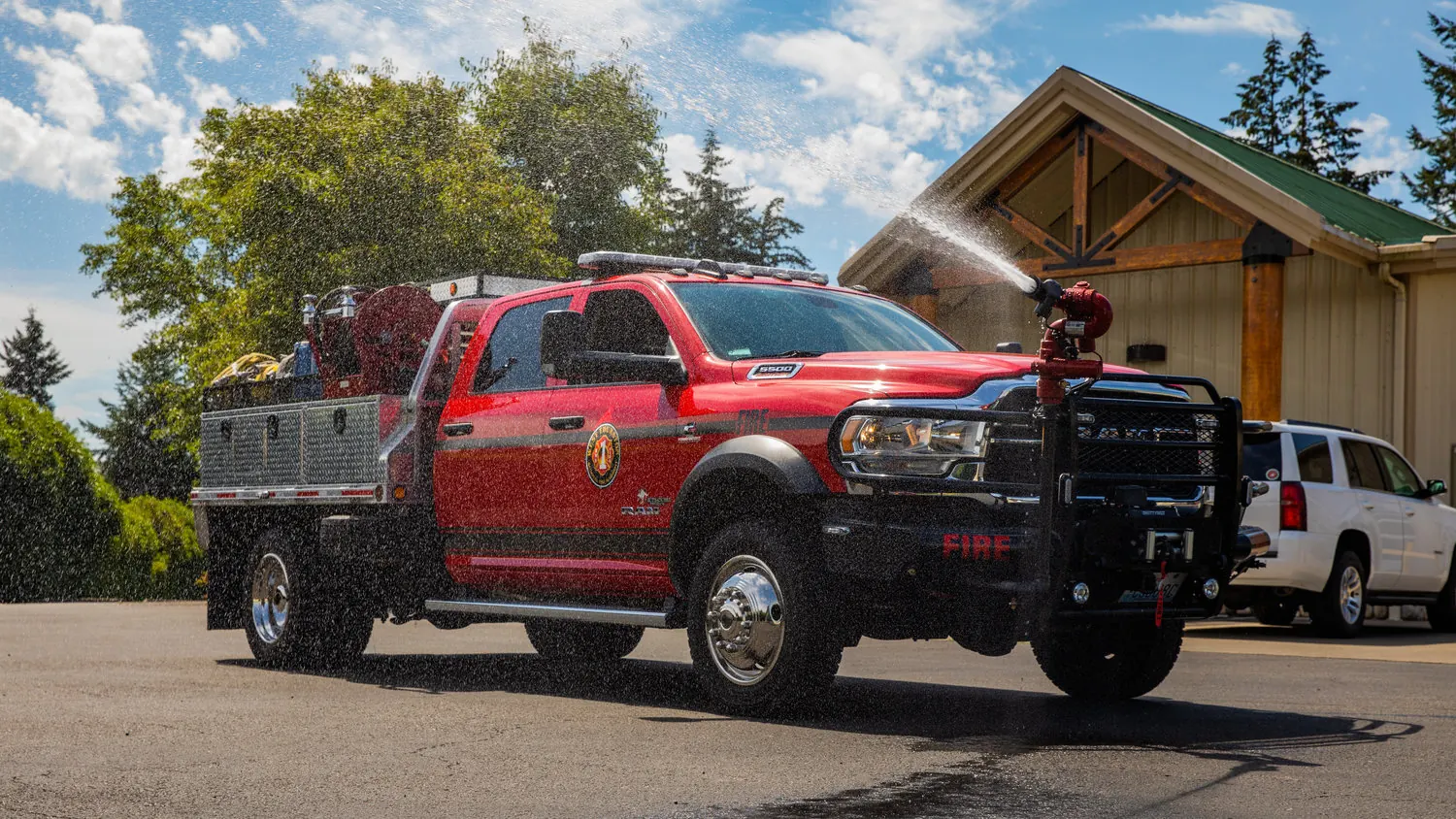 Outback brush truck spraying from its bumper turret in West Thurston, Washington